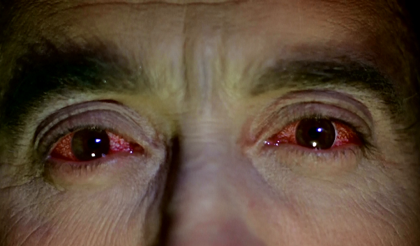 Photo of Christopher Lee as Dracula from the 1968 movie Dracula Has Risen from the Grave. Close-up of his red eyes.